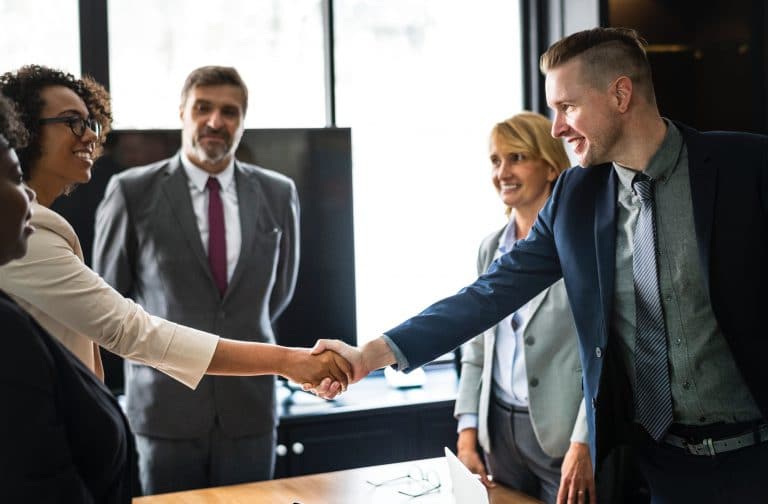 two business people shake hands