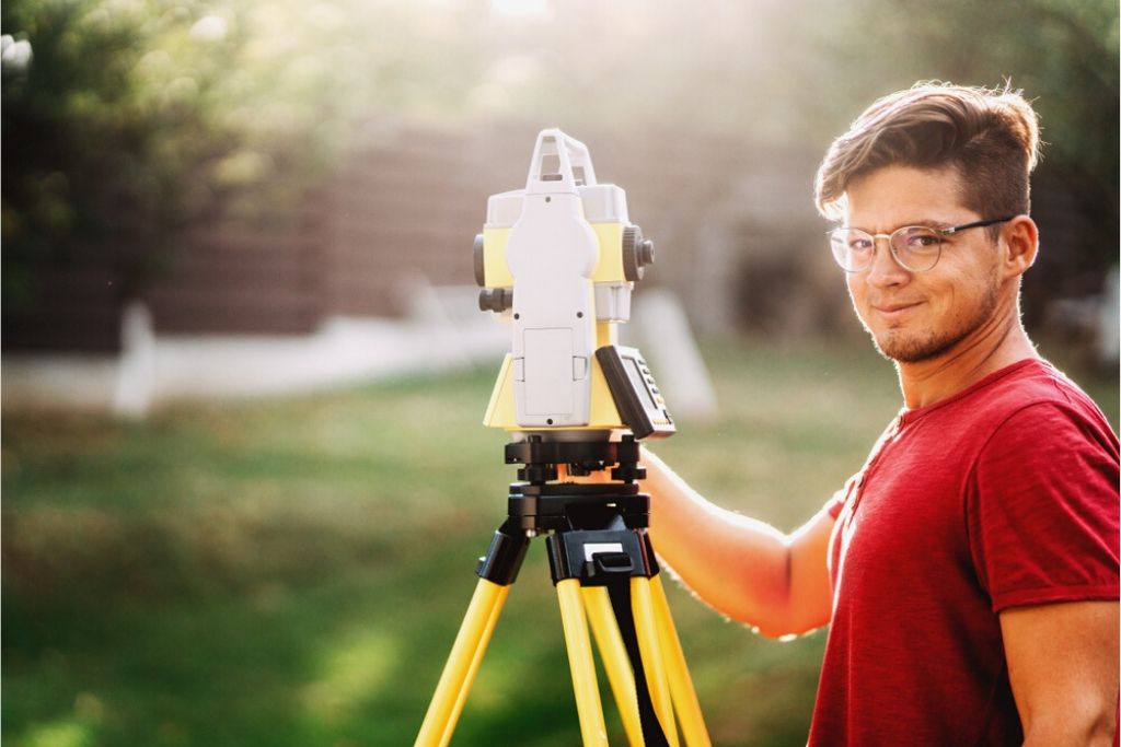 university student learning surveying by using a total station