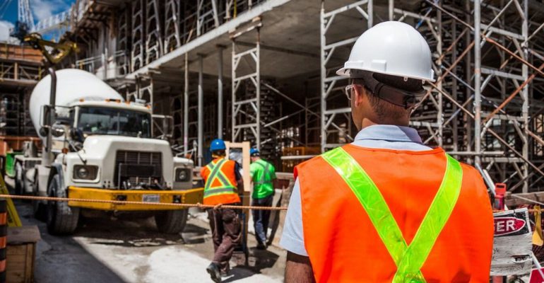 An energy resource manager checks building construction