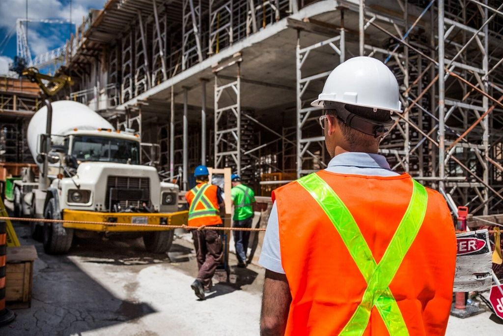 An energy resource manager checks building construction