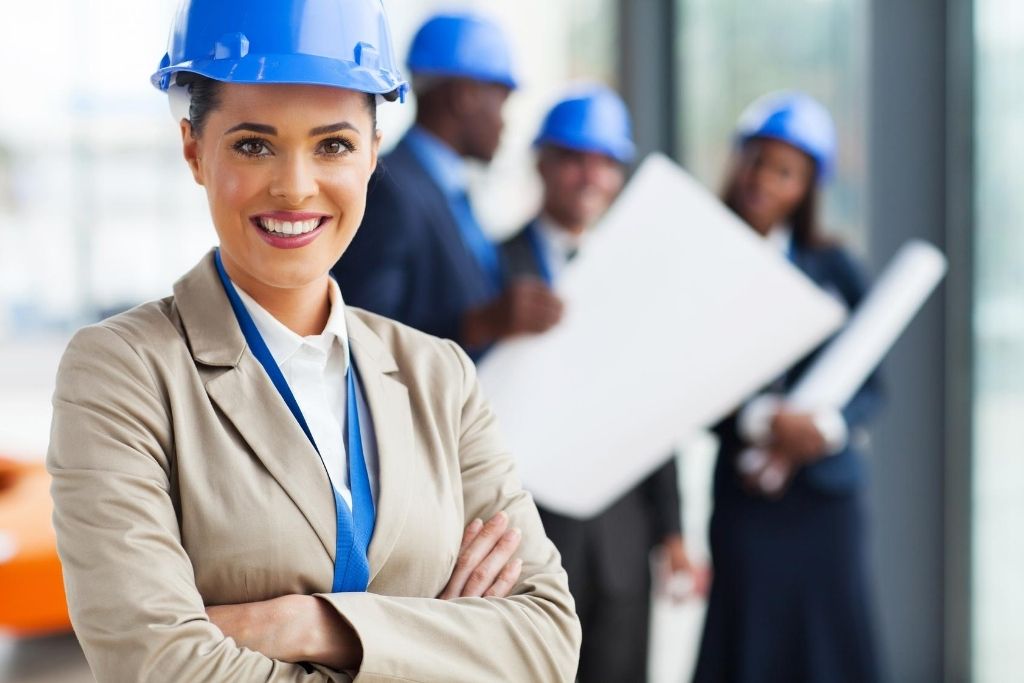 A young female construction manager works at a building site