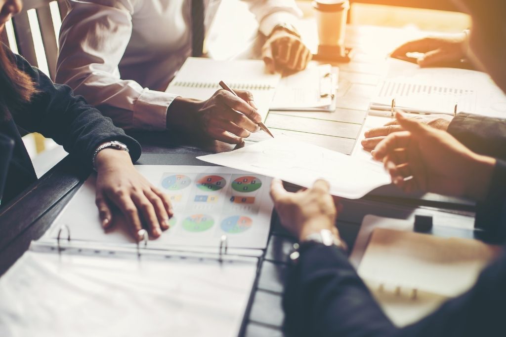 Business professionals having a meeting at a table.