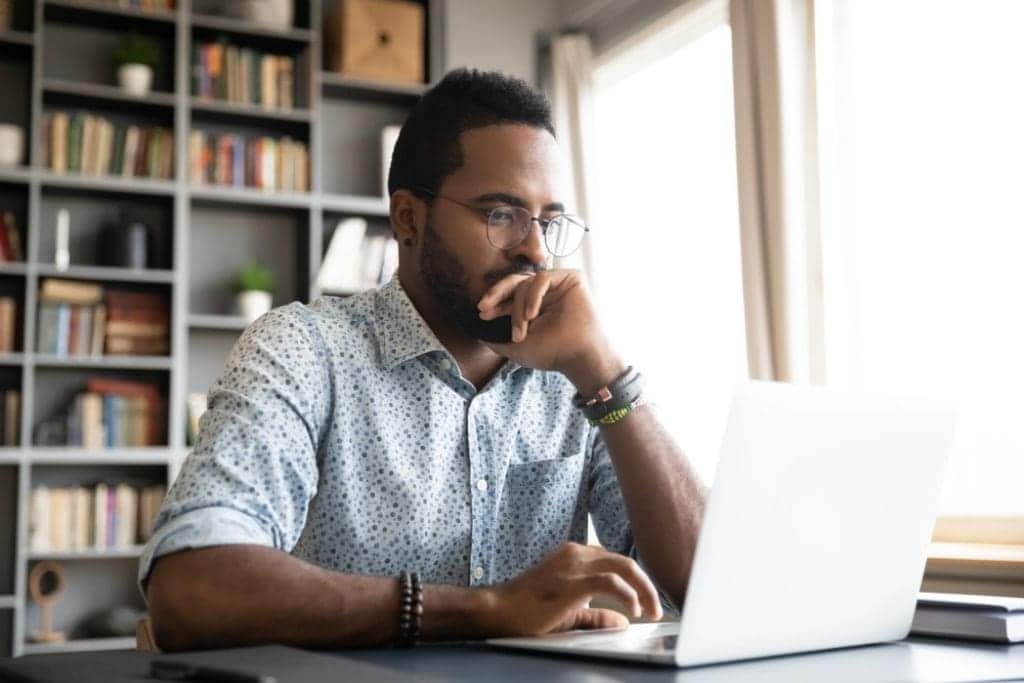 An adult male college student doing an online course.