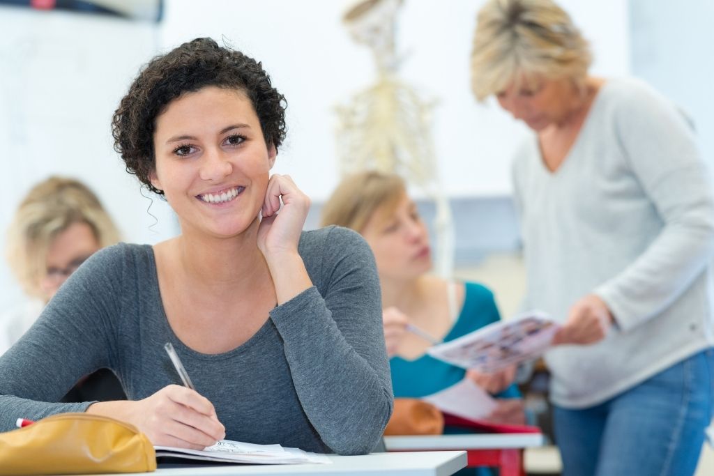 A female alternative medicine student sits in class.