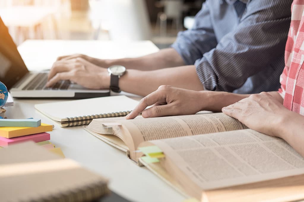 Students study together at a table