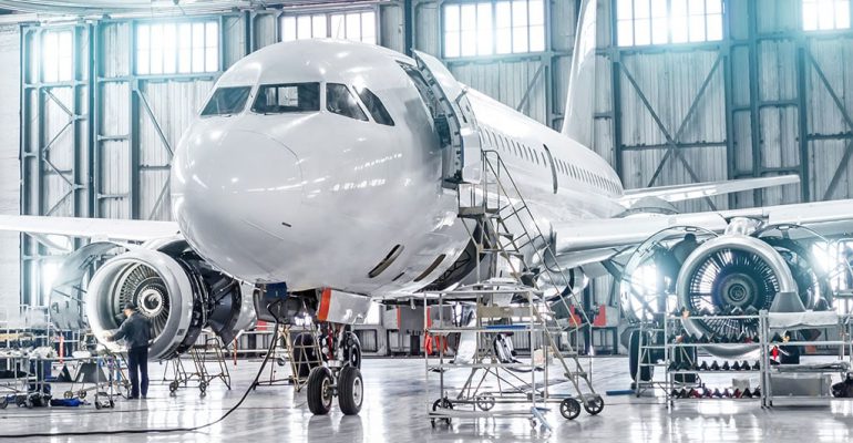 An airplane getting maintained.