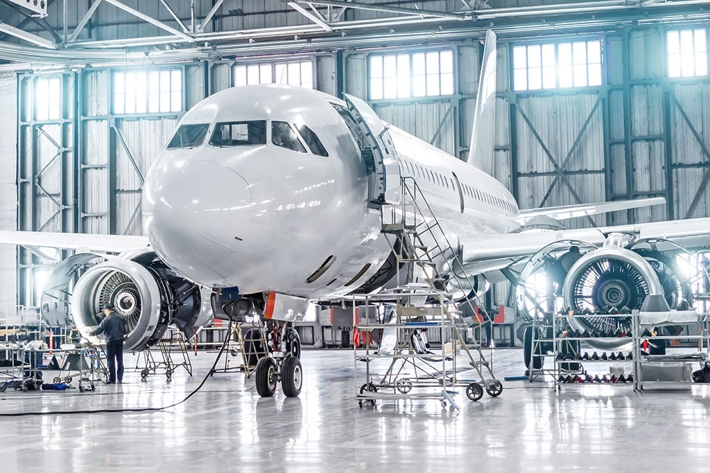 An airplane getting maintained.