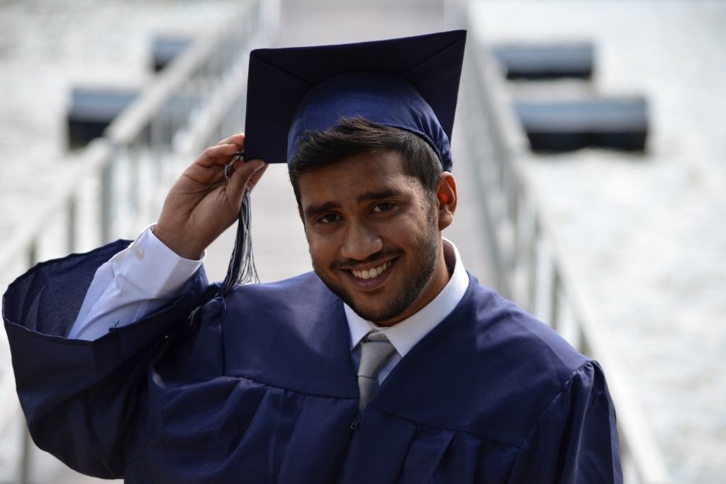 Older student wearing university regalia