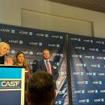 Everglades University President Kristi Mollis speaking at a podium during the CASF dinner.