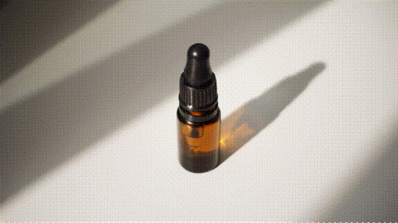 Amber glass essential oil bottle with dropper, illustrating plant-extracted compounds used in aromatherapy