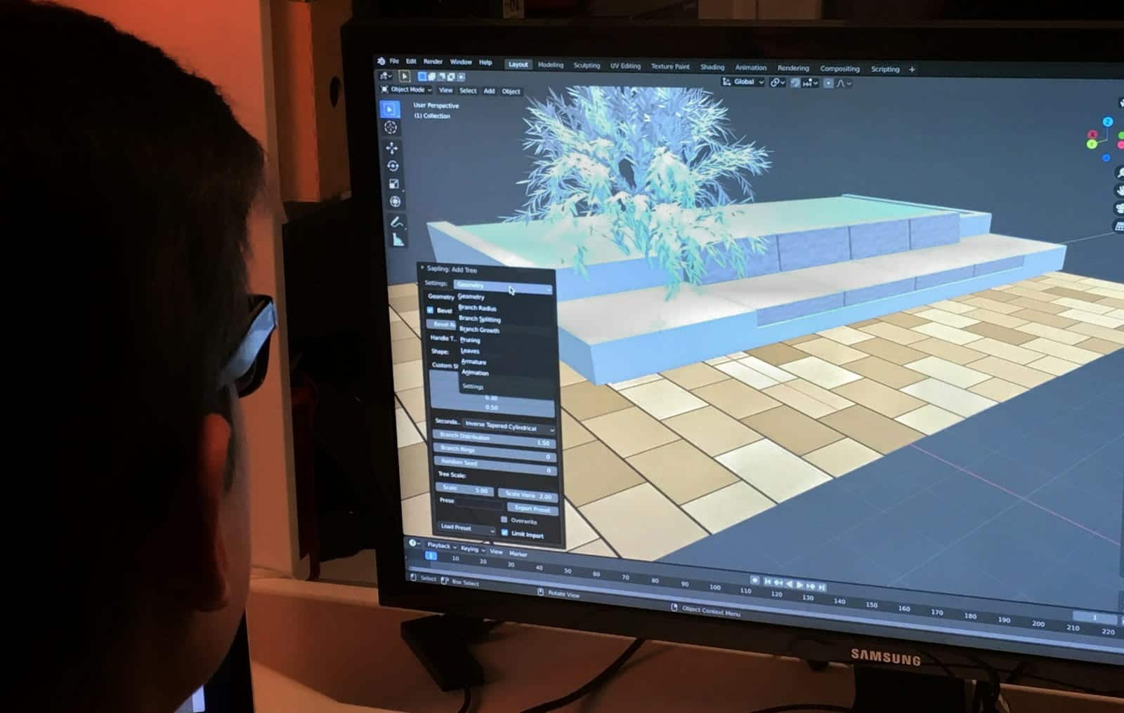 Professional reviewing a digital building model on a computer screen using BIM software