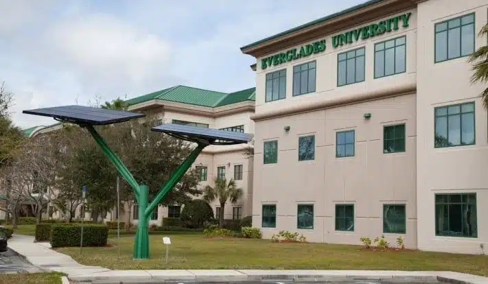 Everglades University Sarasota campus building with a solar tree installation