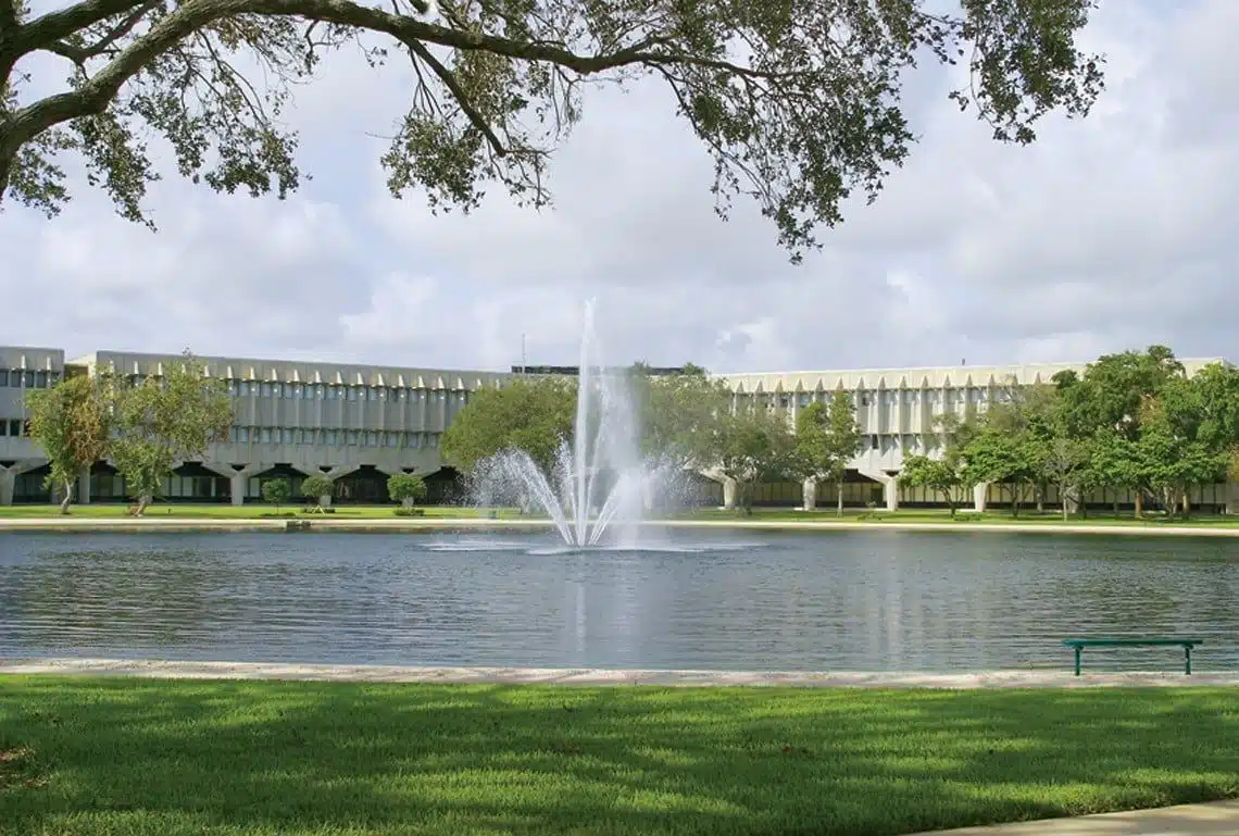 Lake with a fountain on the Everglades University Boca Raton campus grounds