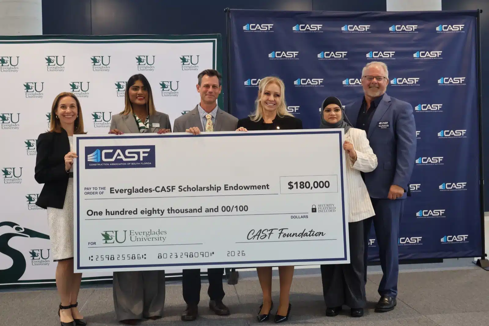 CASF and Everglades University leaders present the $180,000 check to the Everglades-CASF Scholarship Endowment at the first annual CASF/EU Construction Management Job Fair.